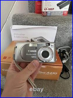 Canon A430 Digital Camera W Selphy CP720 Printer & Photo Pack CP710