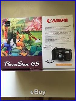 Canon power shot G5 digital camera barely used. Color black. Original box