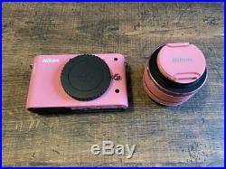 Nikon 1j1 digital camera with color pink lens, SD card, cap